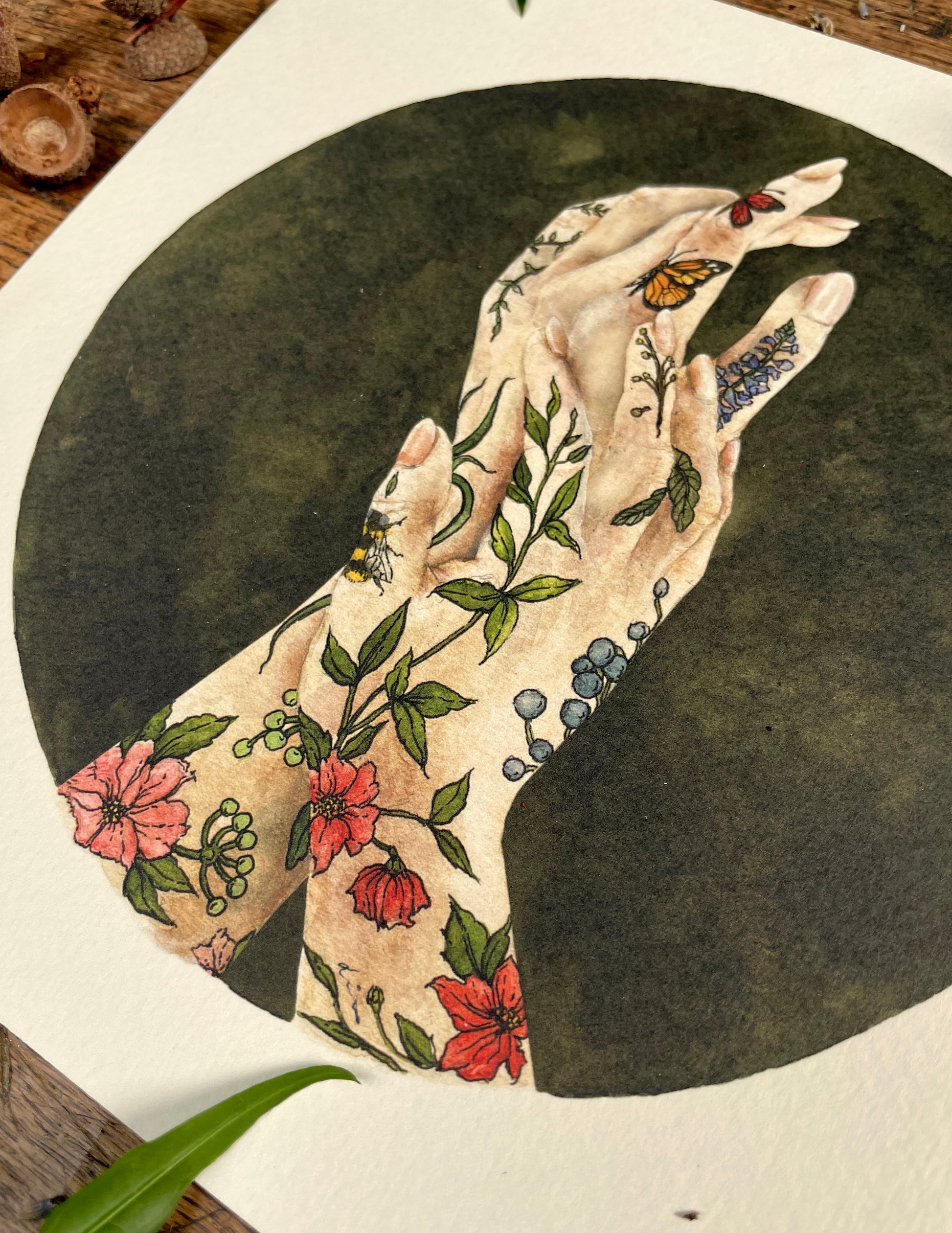 Artistic depiction of a hand with floral and butterfly tattoos on a dark background